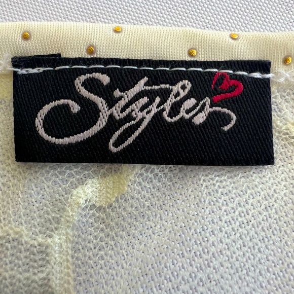 Cream color sleeveless top.Has Gold color Dots and a lace see through back. - Picture 7 of 8